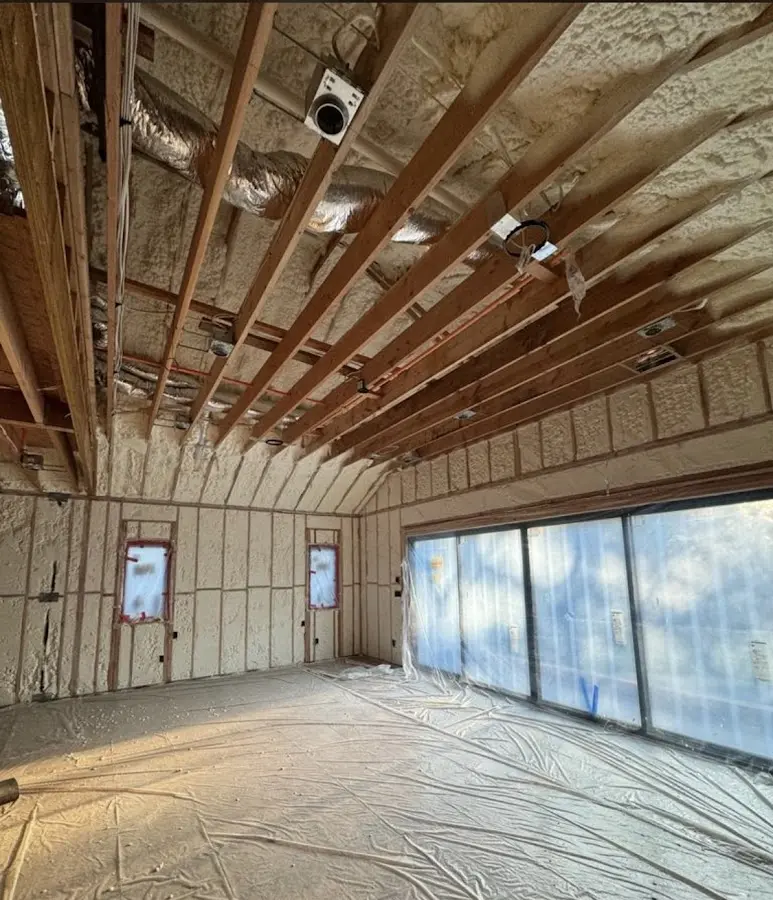 Interior walls and ceiling insulated with spray foam during new construction in Greensboro